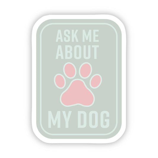 A sticker designed by  Anna Alsup that says "Ask me about my dog"