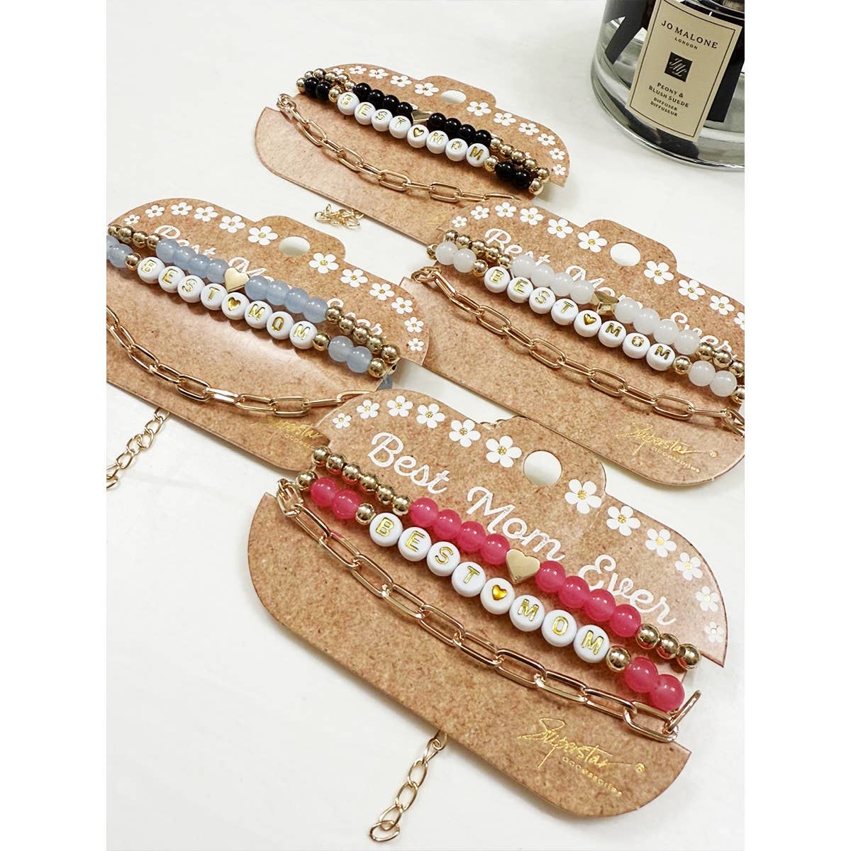 Best Mom bracelet set in black, white, blue, and pink.