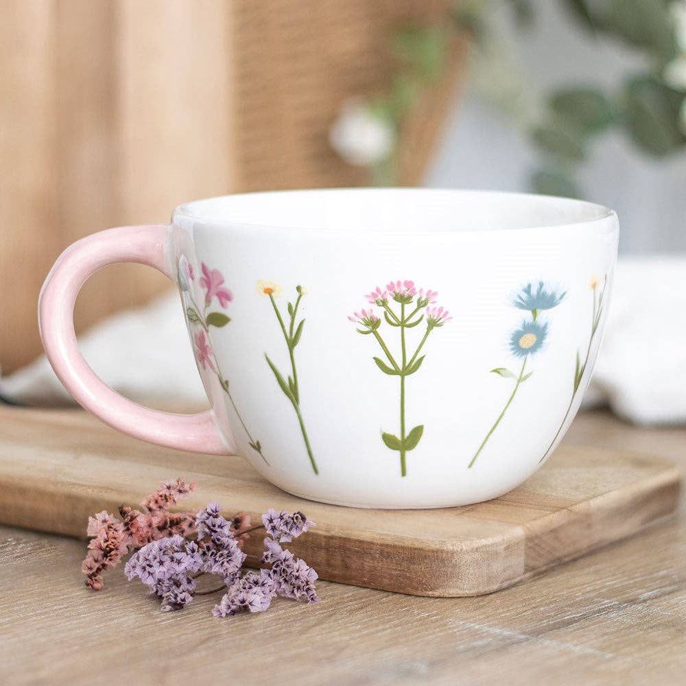 A mug with a floral pattern in the "Blooming Lovely" collection.