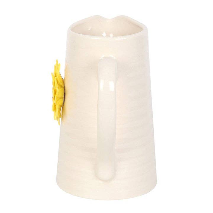 Side view of a ceramic flower vase shaped like a water jug with a 3D sunflower design.