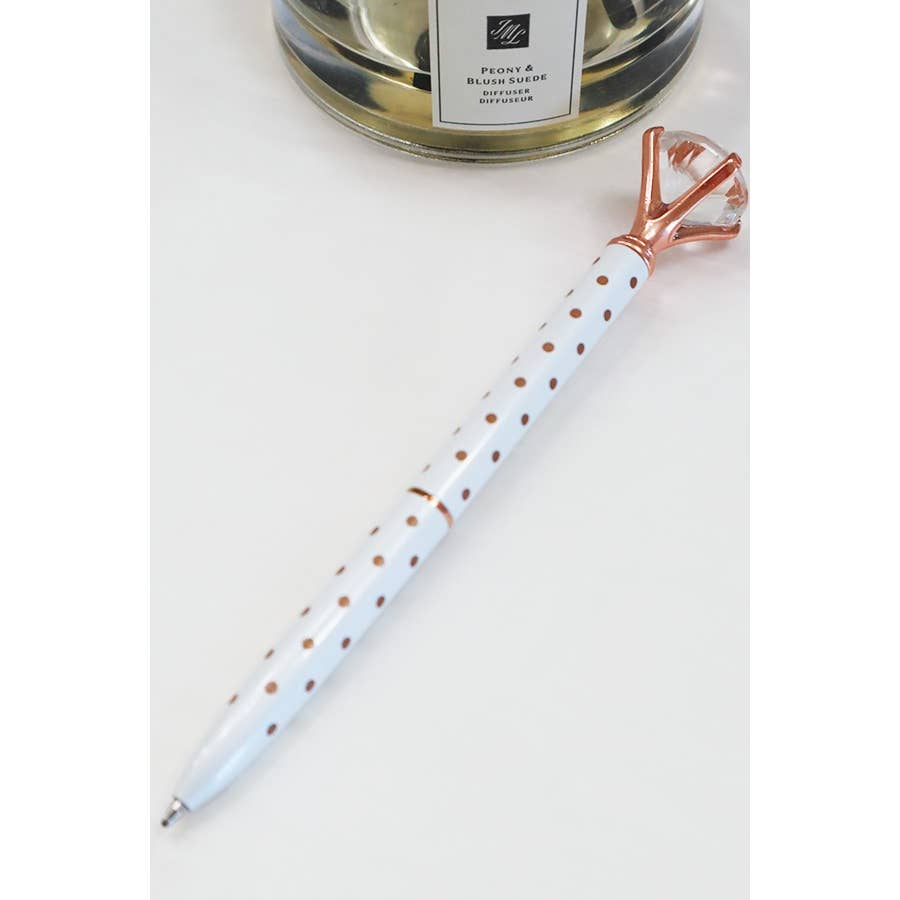 A sleek metallic pen with a large diamond on the end.