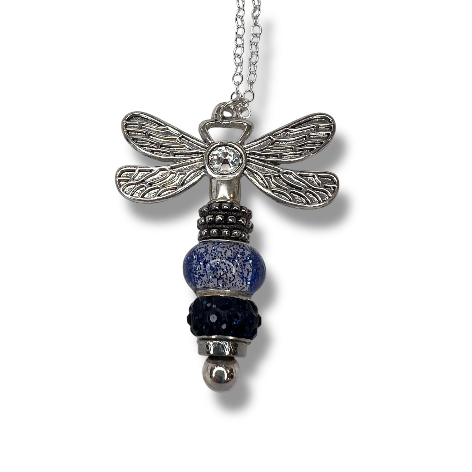 Handmade dragonfly necklace with navy beaded tail.