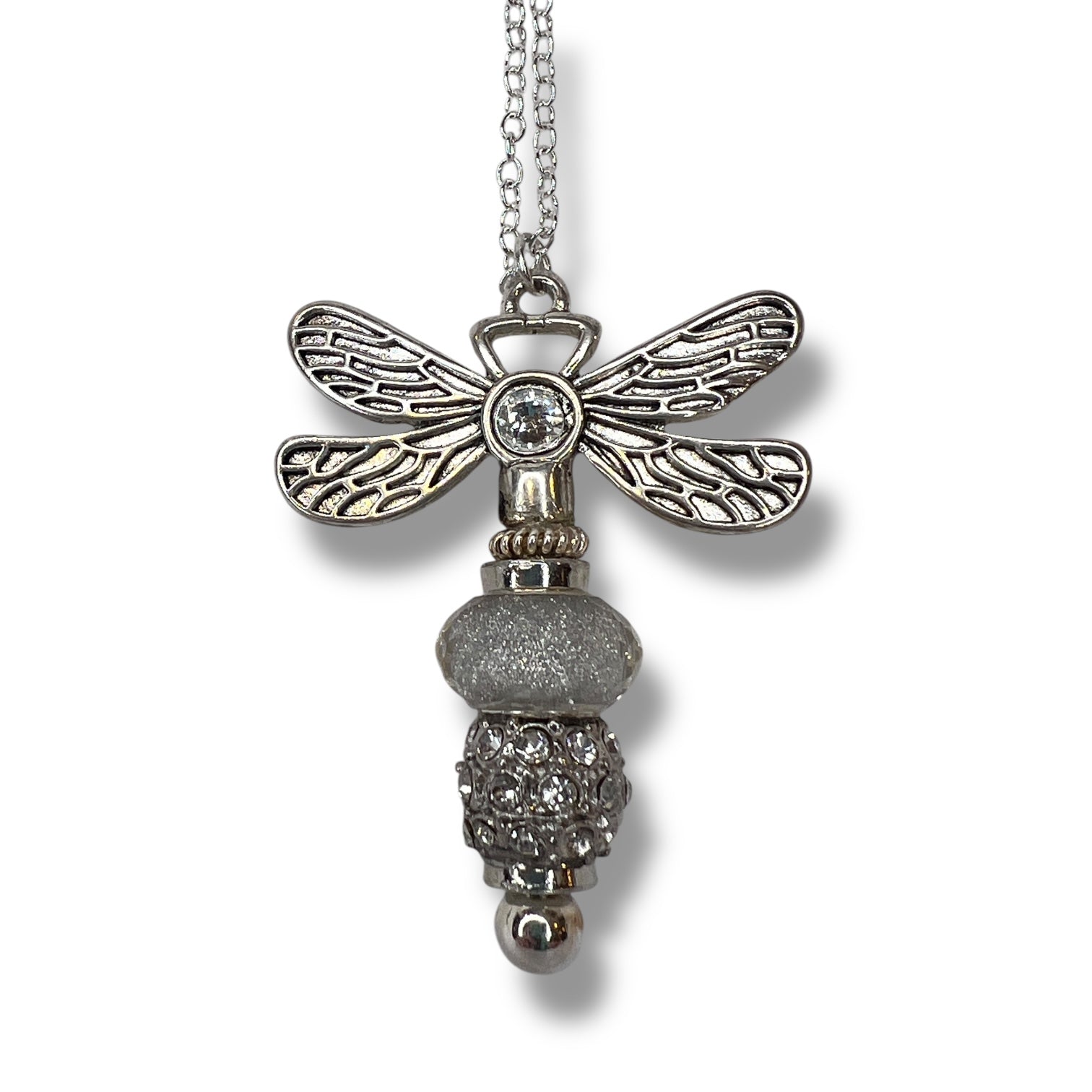 Handmade dragonfly necklace with a silver beaded tail.