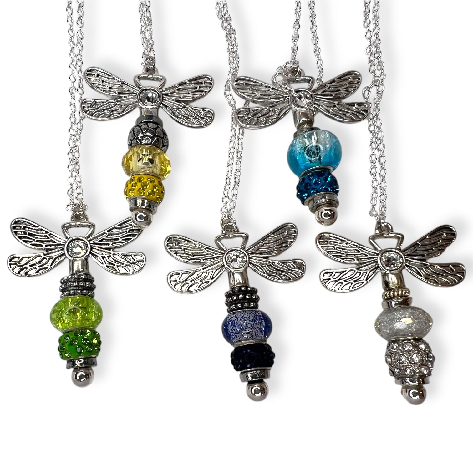Handmade dragonfly necklaces with beaded tails in various colors.