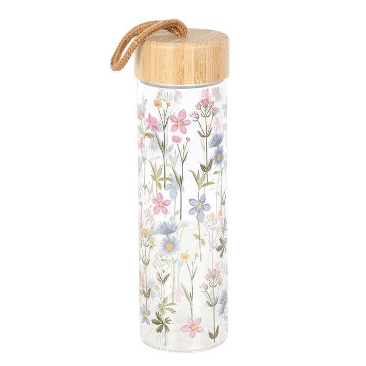 Floral glass water bottle with a bamboo lid and carrying loop.