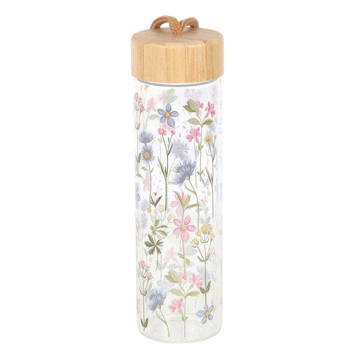 Floral glass water bottle with a bamboo lid and carrying loop.