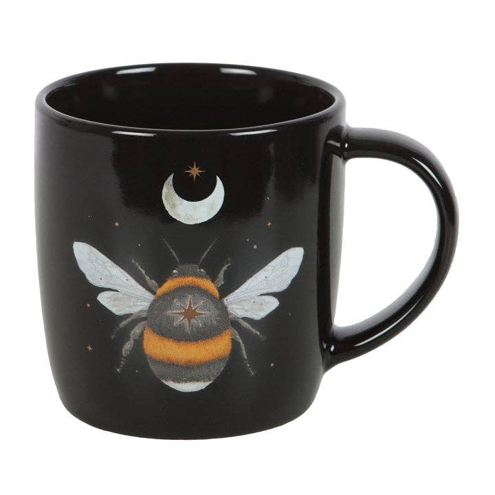 Back view of black mug with forest bee design.