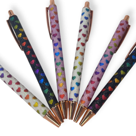 Thick pen with a glittery heart design.