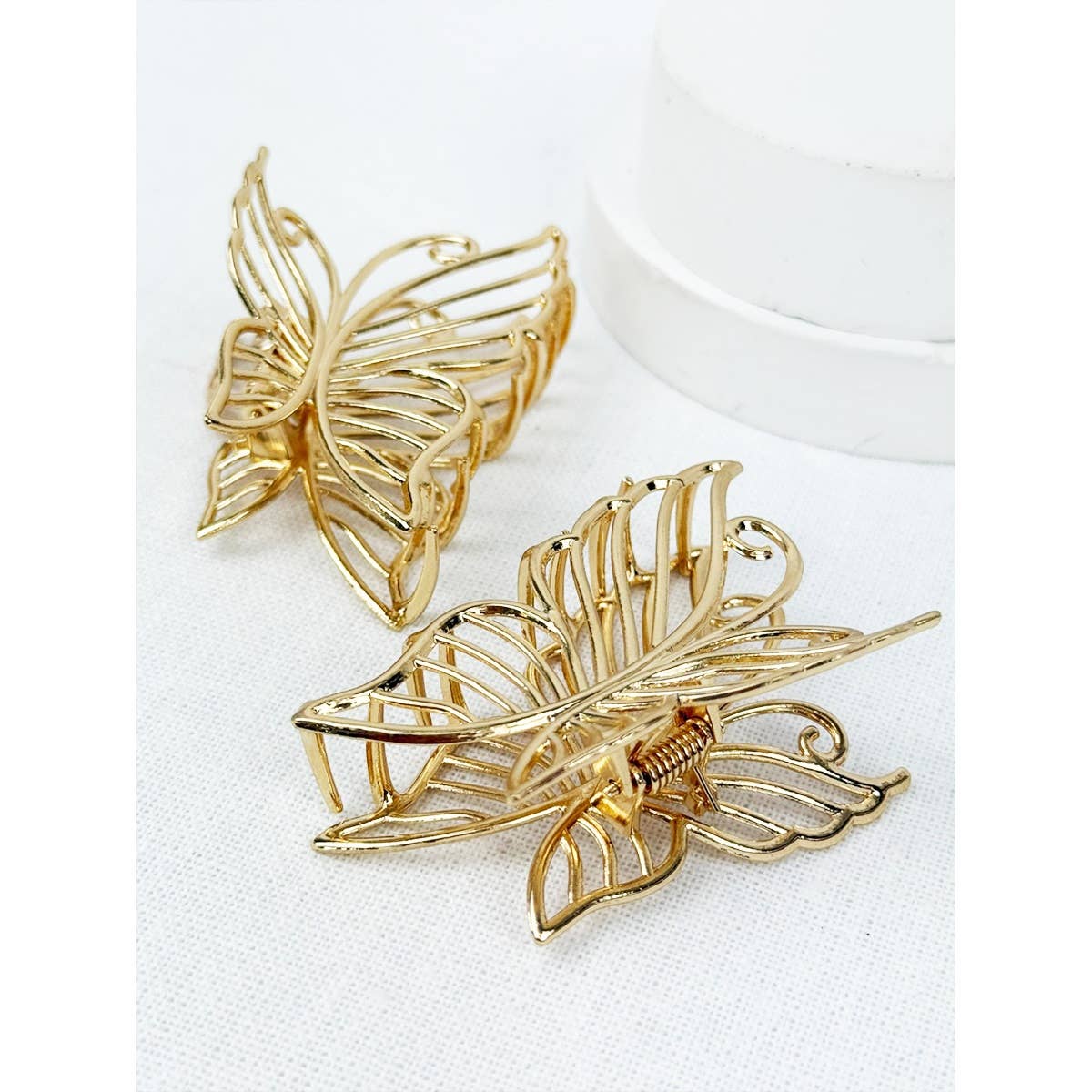 Close up of gold metal butterfly hair claw.
