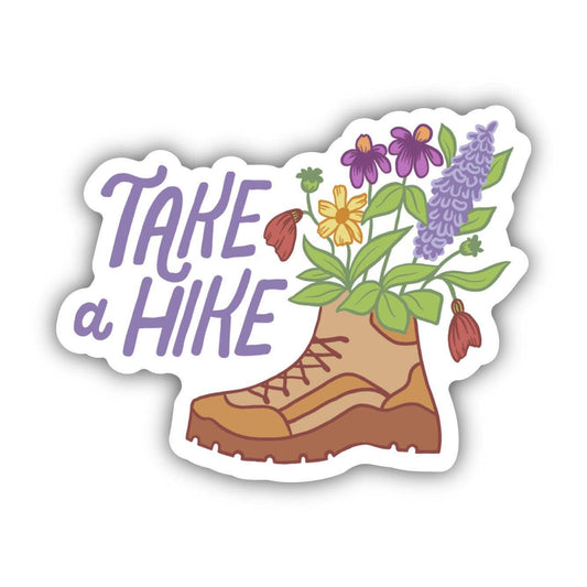 Sticker with flowers sticking out of a boot and the phrase "Take a Hike"