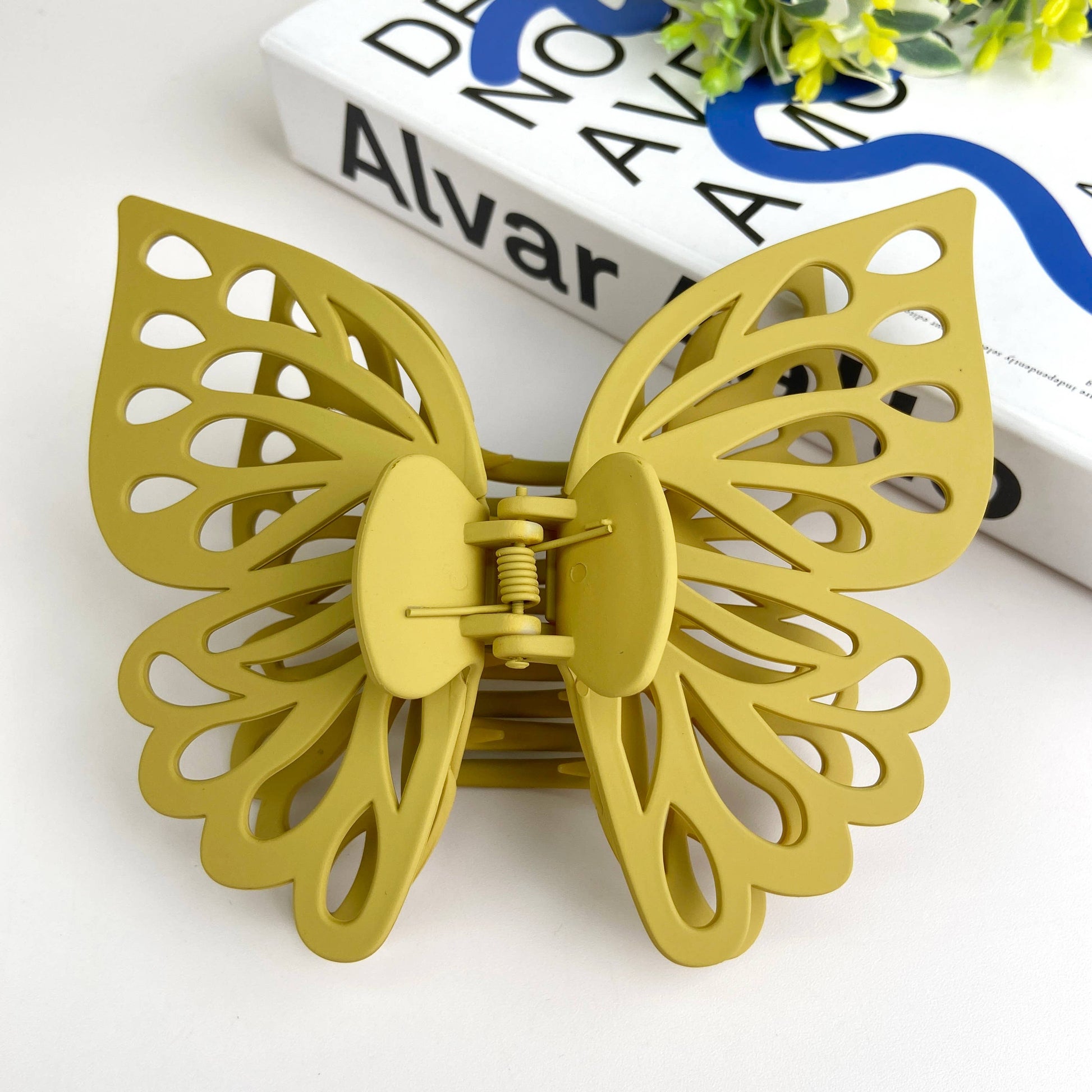 Large butterfly hair claw in green.