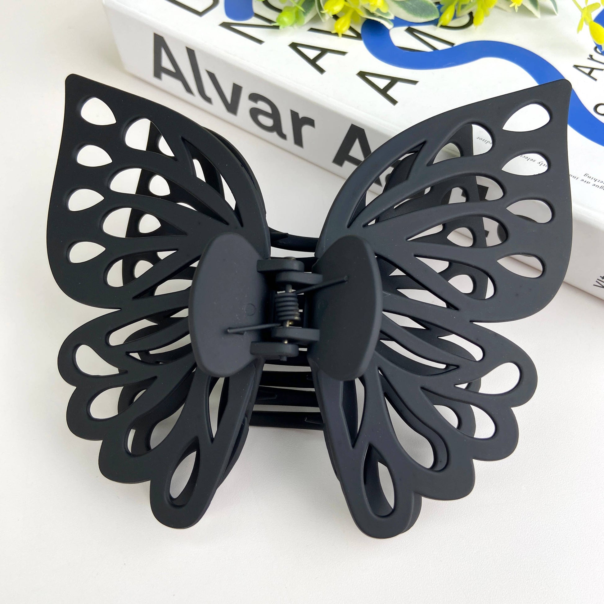 Large butterfly hair claw in black.