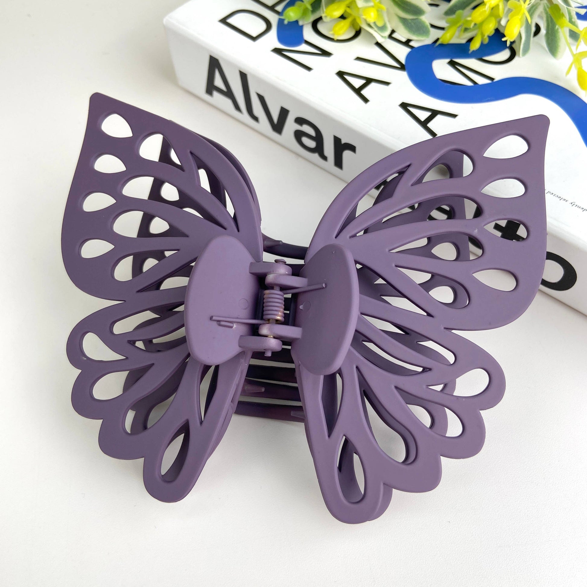 Large butterfly hair claw in purple.