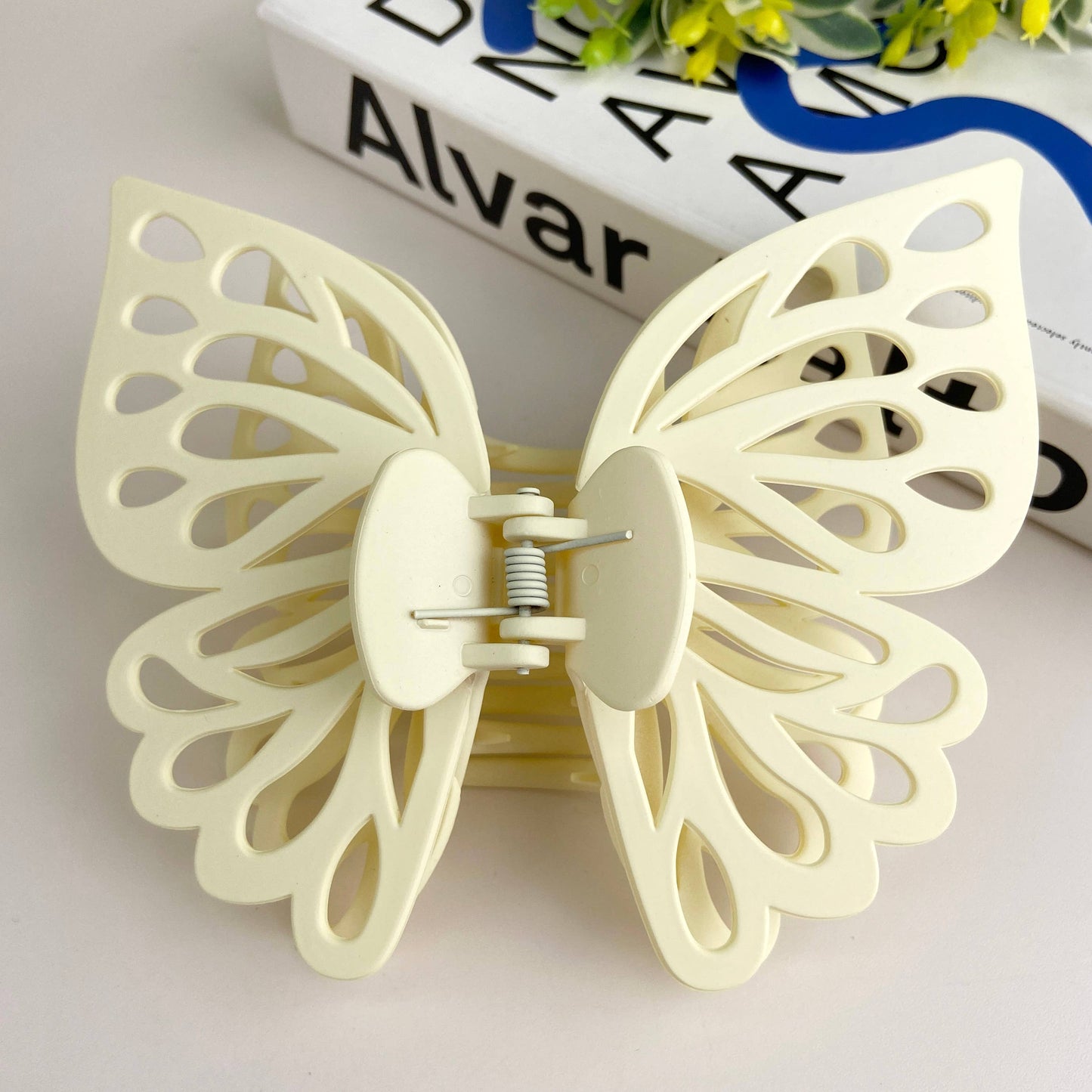 Large butterfly hair claw in ivory.