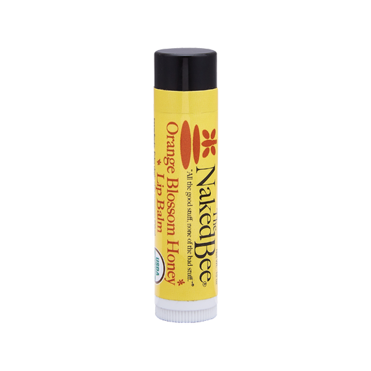 Certified organic lip balm by The Naked Bee in Orange Blossom honey flavor.
