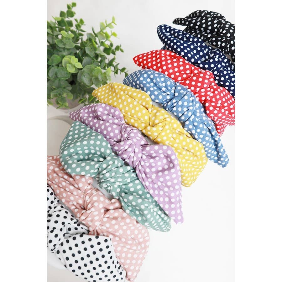 Closeup of top knot bow on polka dot headbands
