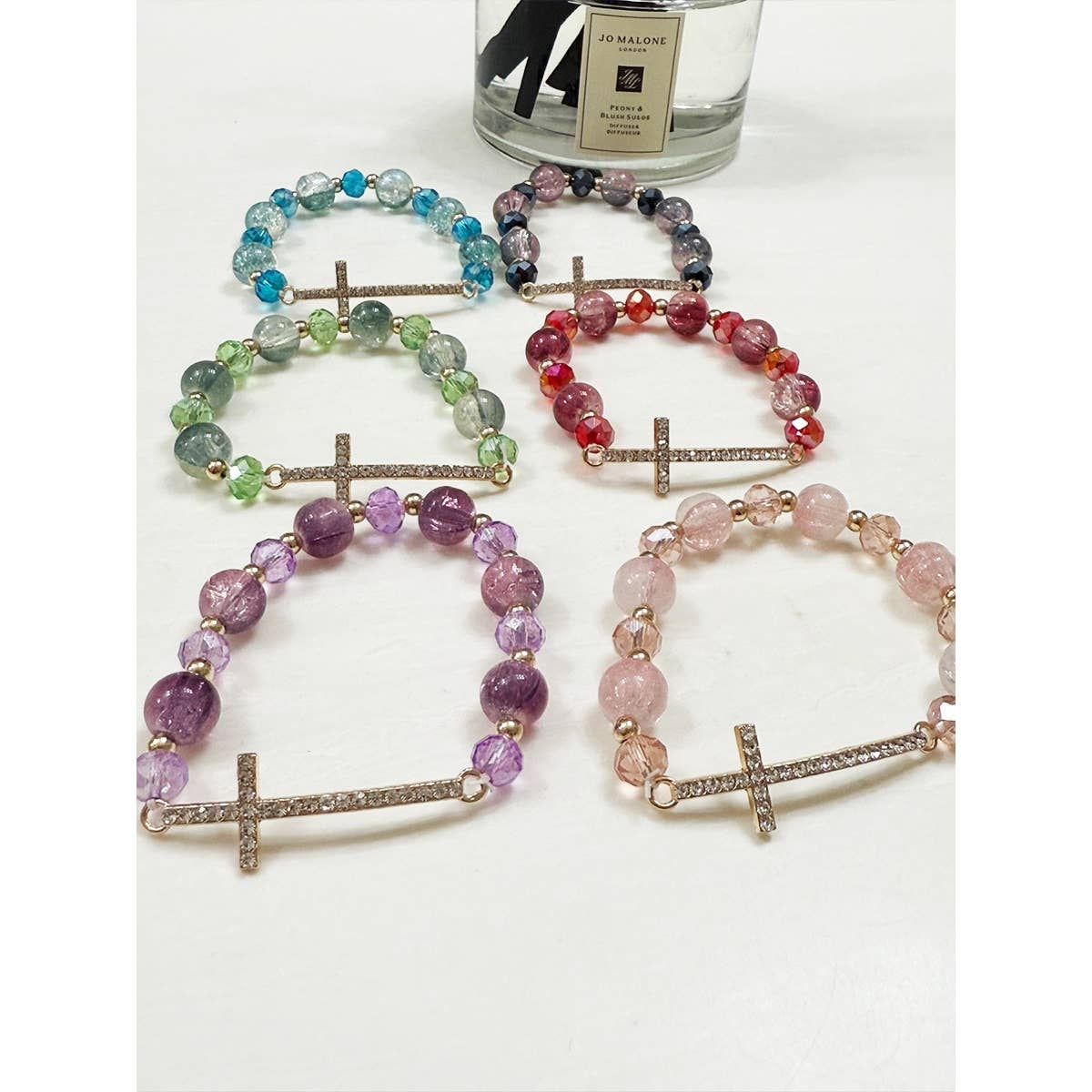 Rhinestone cross beaded stretch bracelets.