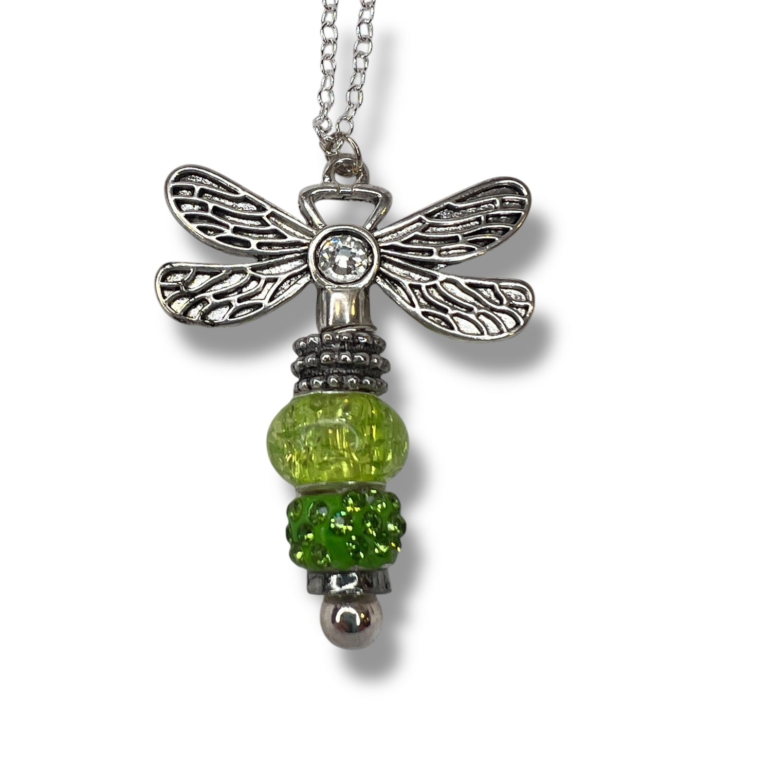 Handmade dragonfly necklace with a beaded green tail.