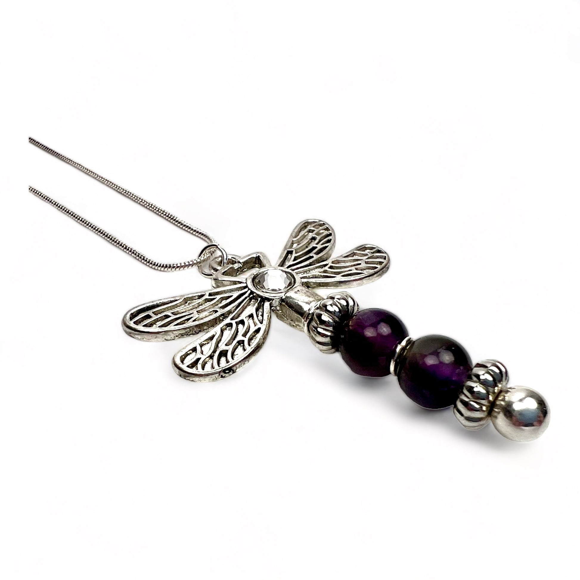 Angled view of the amethyst dragonfly necklace