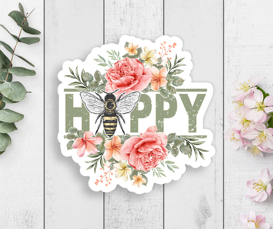 Sticker with the word happy and a bee in place of the a, for a sentiment to be happy! Surrounded by florals.