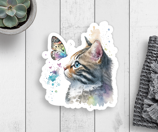 A sticker with a cat profile looking at a colorful butterfly.