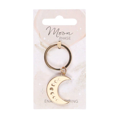 Enamel keychain of a crescent moon decorated with moon phases.