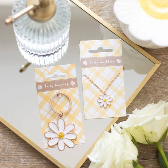 Daisy keychain and daisy necklace, shown for aesthetics and size comparison.