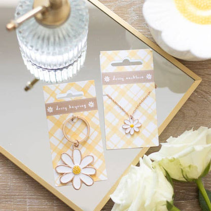 Daisy keychain and daisy necklace, shown for aesthetics and size comparison.