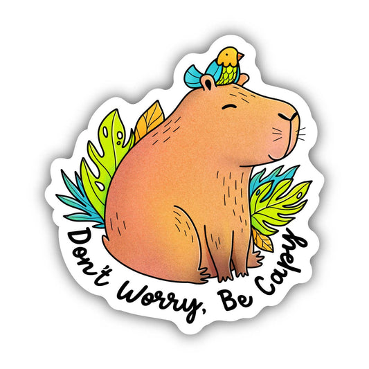 A sticker that says "Don't worry, be capy" with a smiling capybara and a bird on his head.