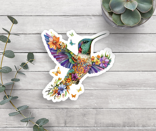 A sticker of a hummingbird surrounded by flowers and butterflies.