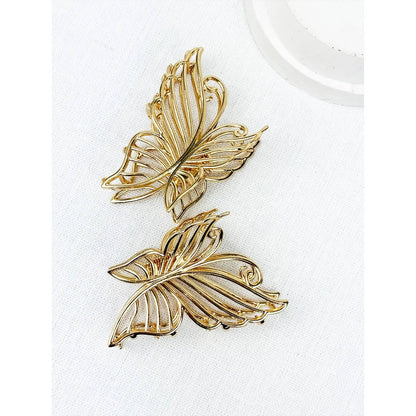 Gold metal butterfly hair claw.