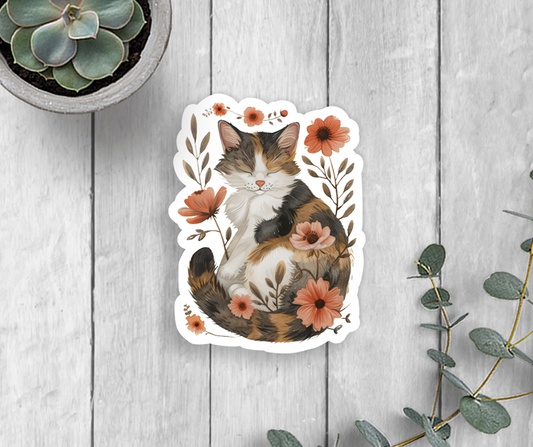 A sticker of a happy and relaxed cat surrounded by pink flowers.