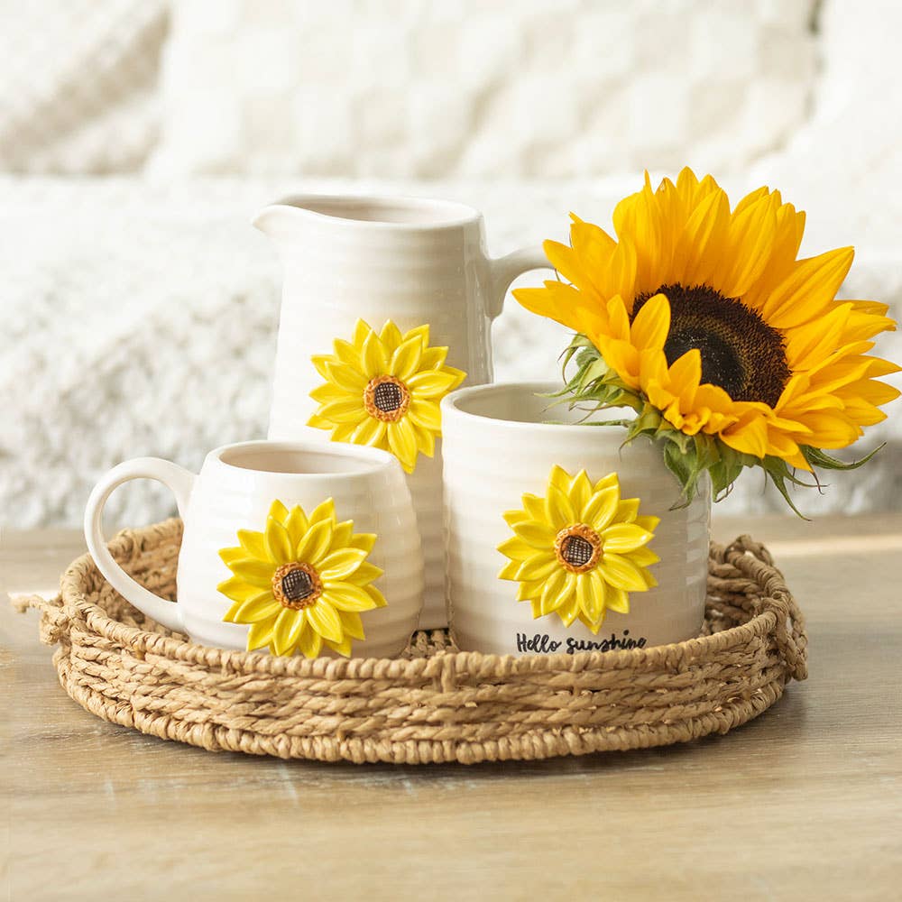 Collection of products with a 3D sunflower design, including a ceramic plant pot, mug, and flower vase. Photo included for size comparison and aesthetics.