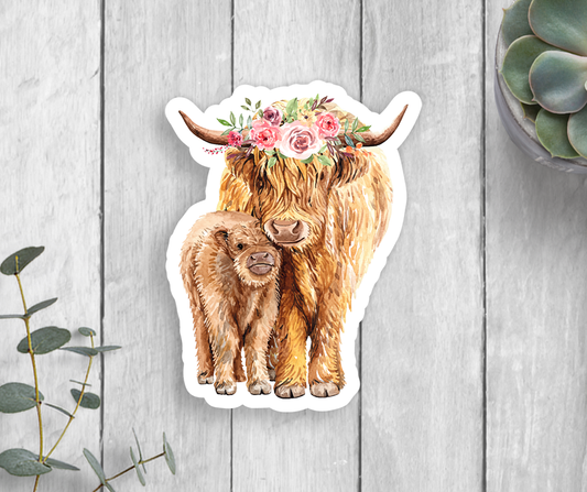 A sticker of a highland cow mama in a flower crown with her baby calf.