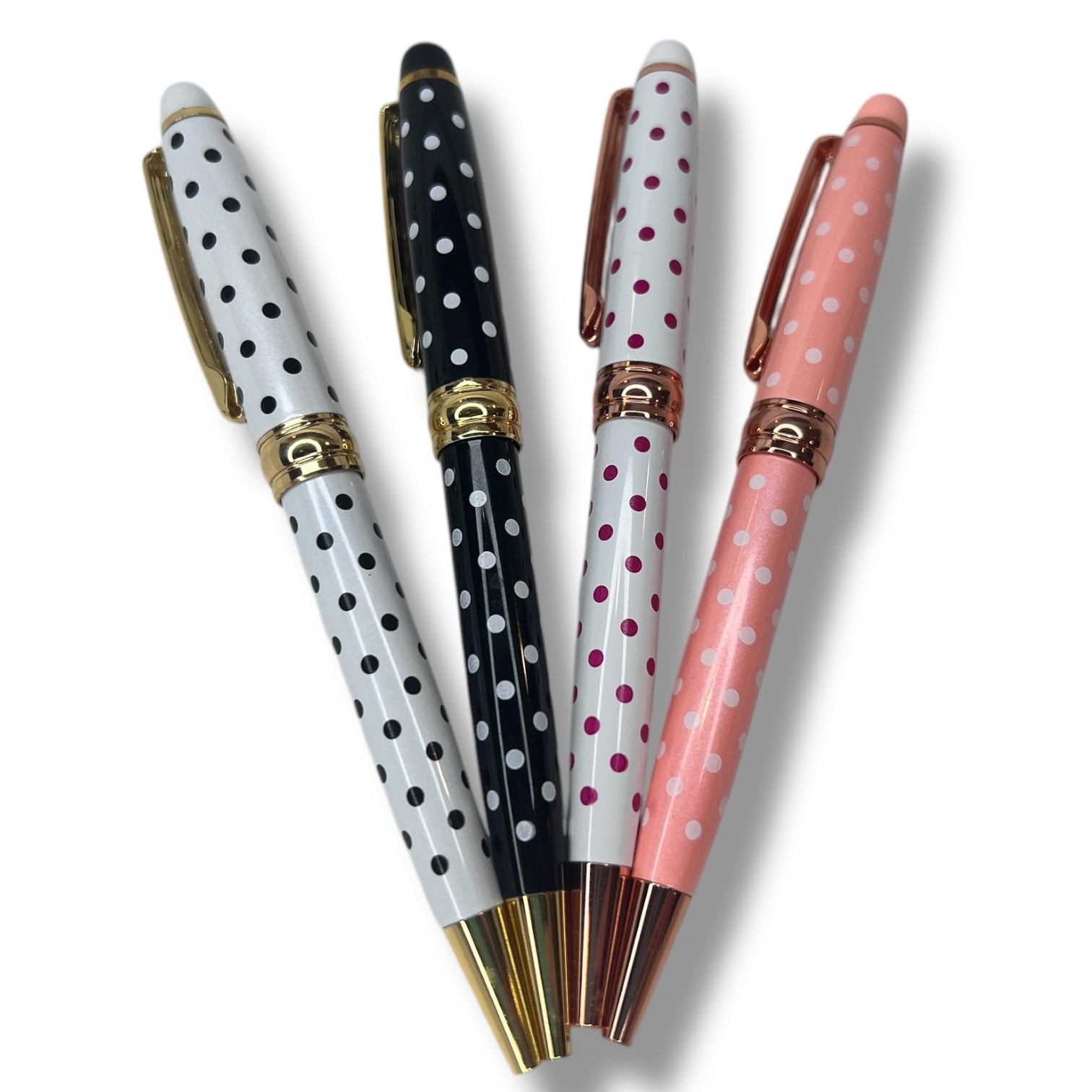 Thick pen with polka dots in shades of white, pink, and black.