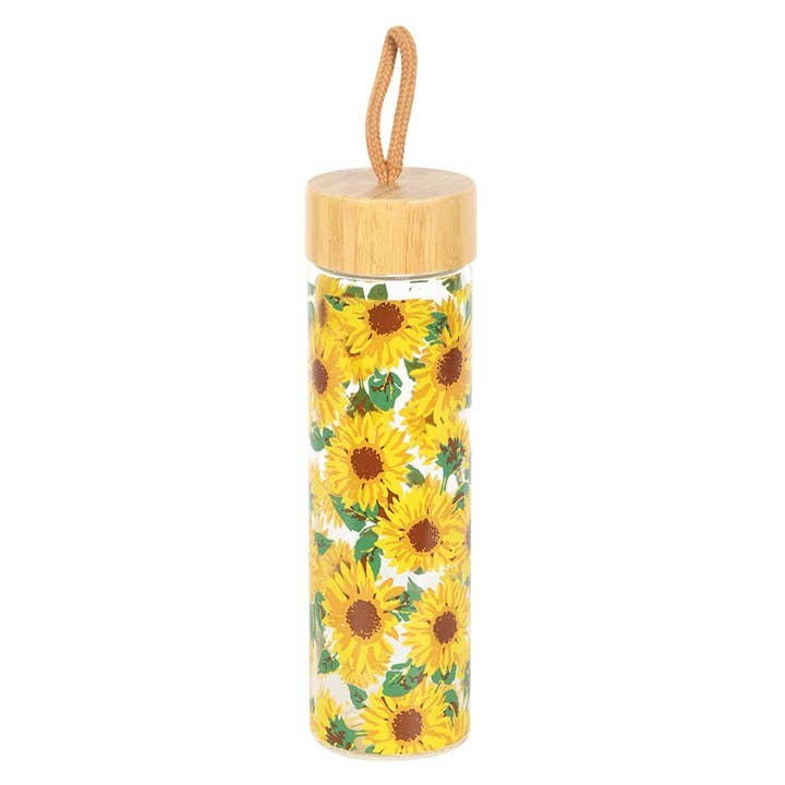 Glass water bottle with an all-over sunflower print, bamboo lid, and carrying loop.