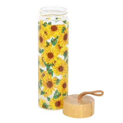 Glass water bottle with an all-over sunflower print, bamboo lid, and carrying loop.